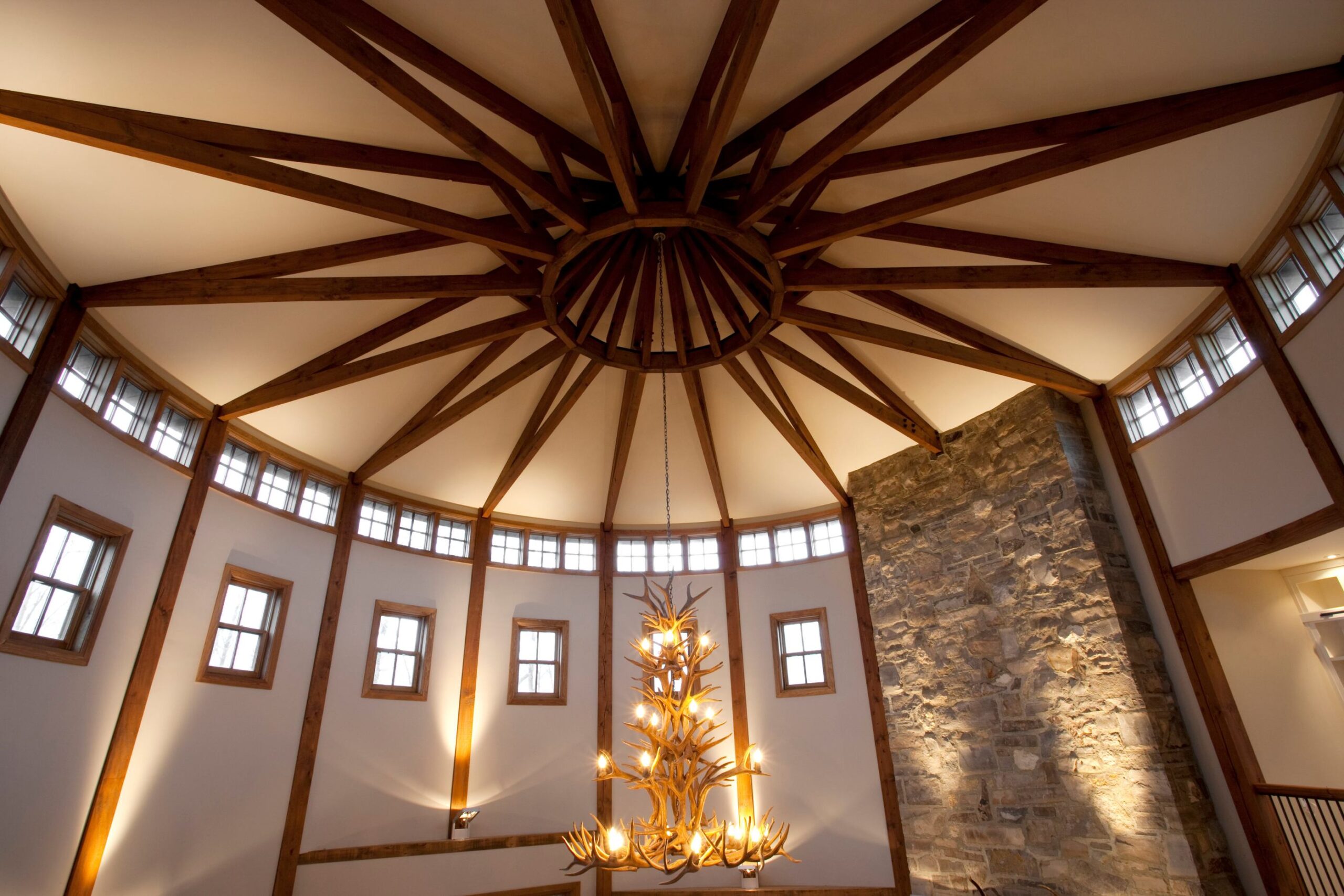Rustic Resort Home architectural highlight– rotunda with timber beam detail on the ceiling