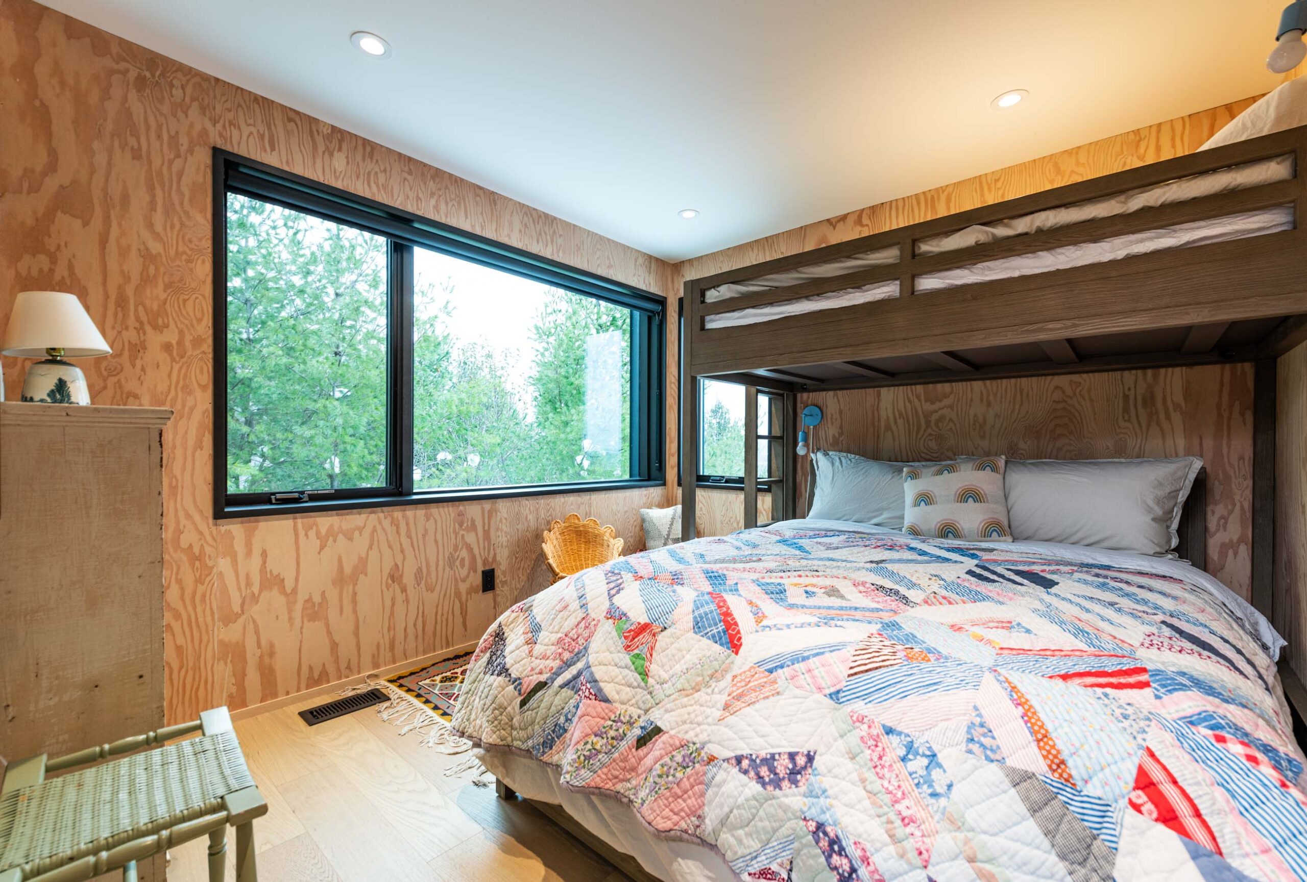 Bedroom with bunkbeds in a Custom Scandi-style Cabin built by Blake Farrow Project Management Inc.