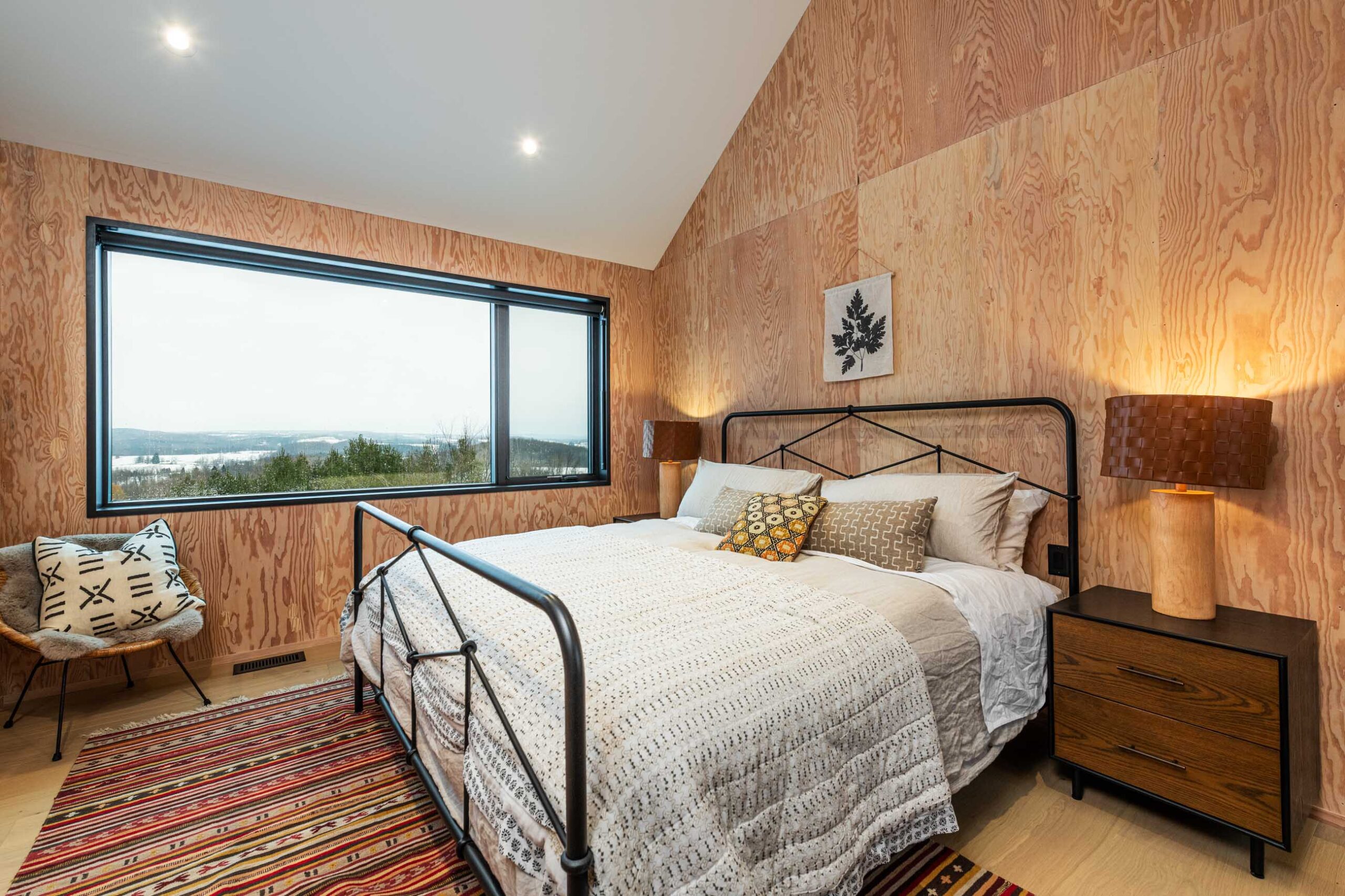 Bedroom in a Custom Scandi-style Cabin built by Blake Farrow Project Management Inc.
