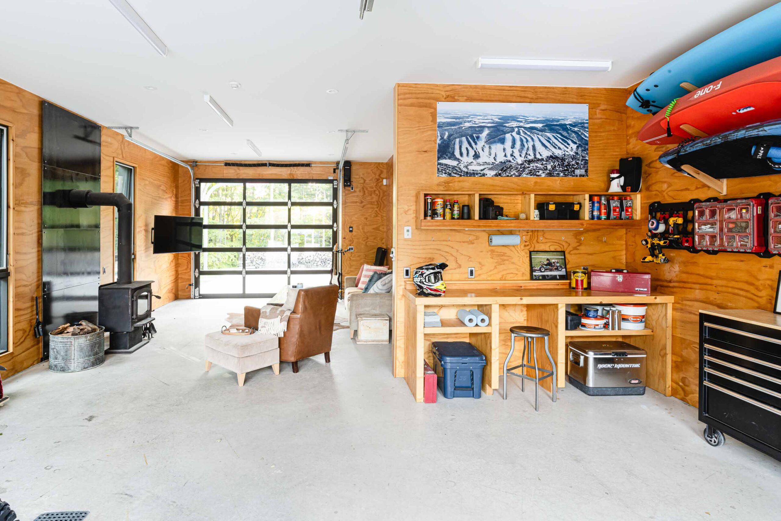 interior of a modern, minimalist garage and shop with plywood interior