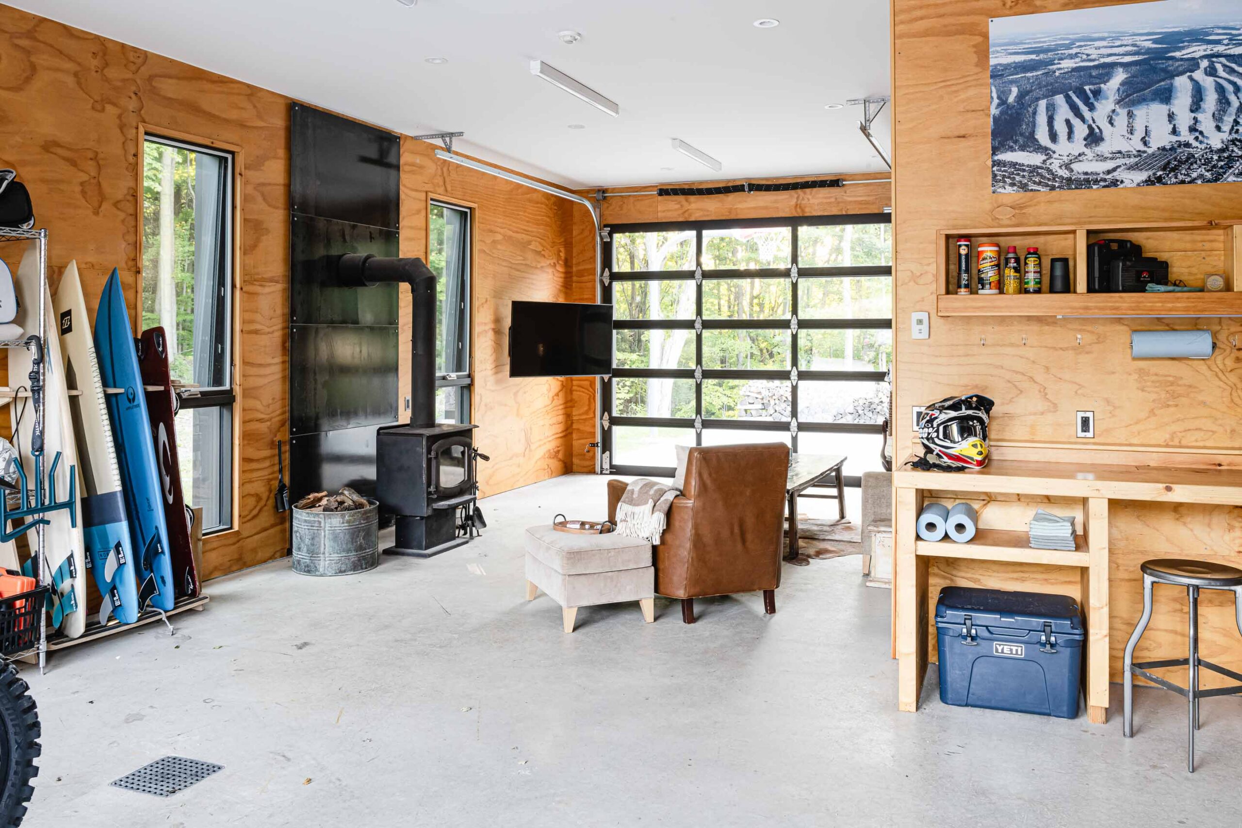 interior of a modern, minimalist garage and shop with plywood interior