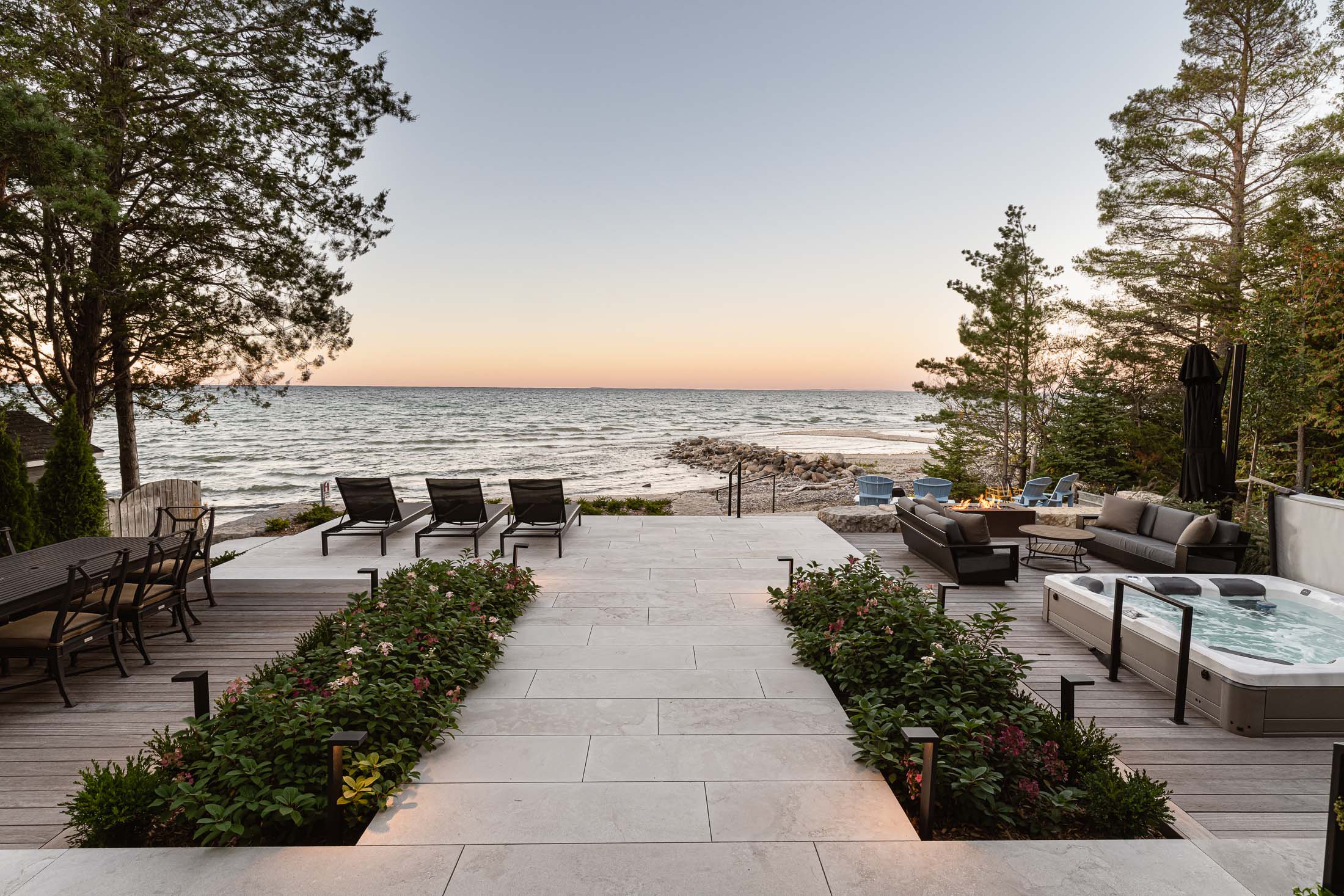 Blue Mountain custom home builder modern beach house with hot tub and outdoor seating areas overlooking the water