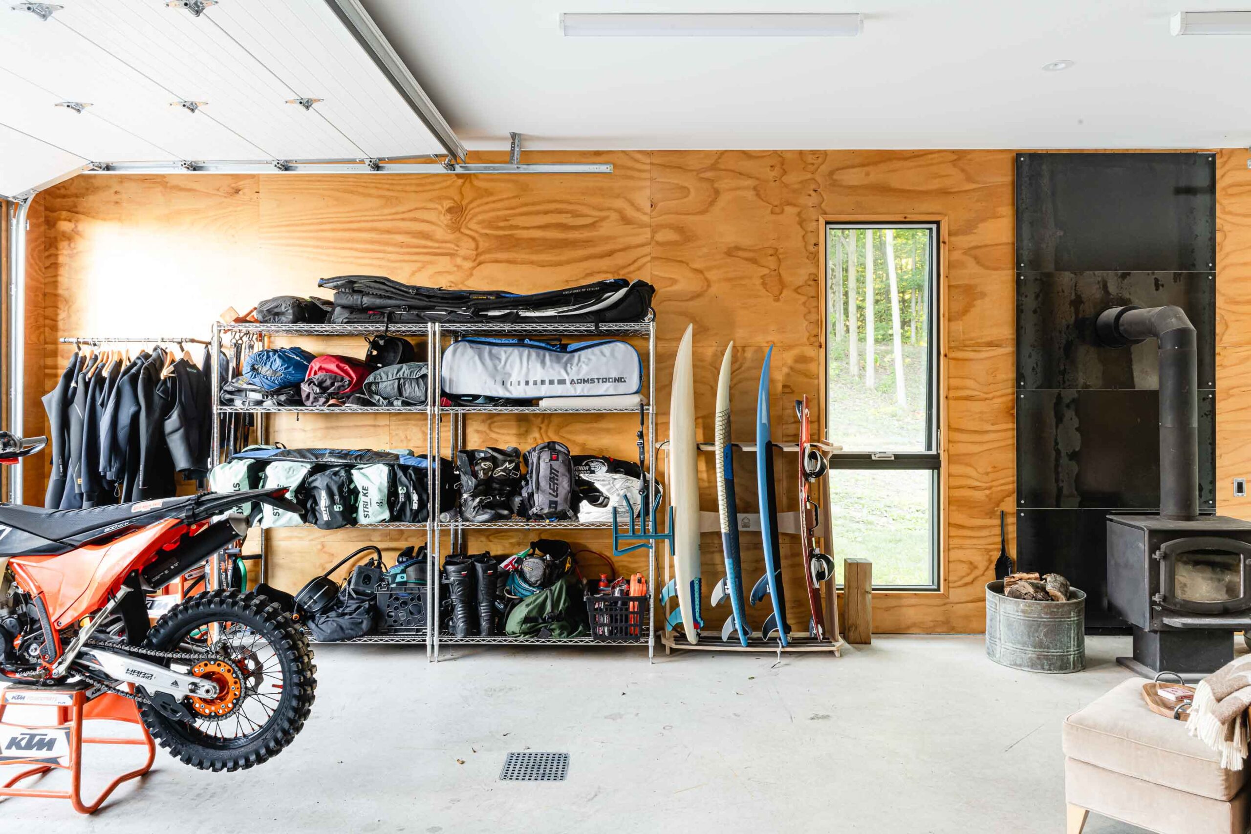 interior of a modern, minimalist garage and shop with plywood interior