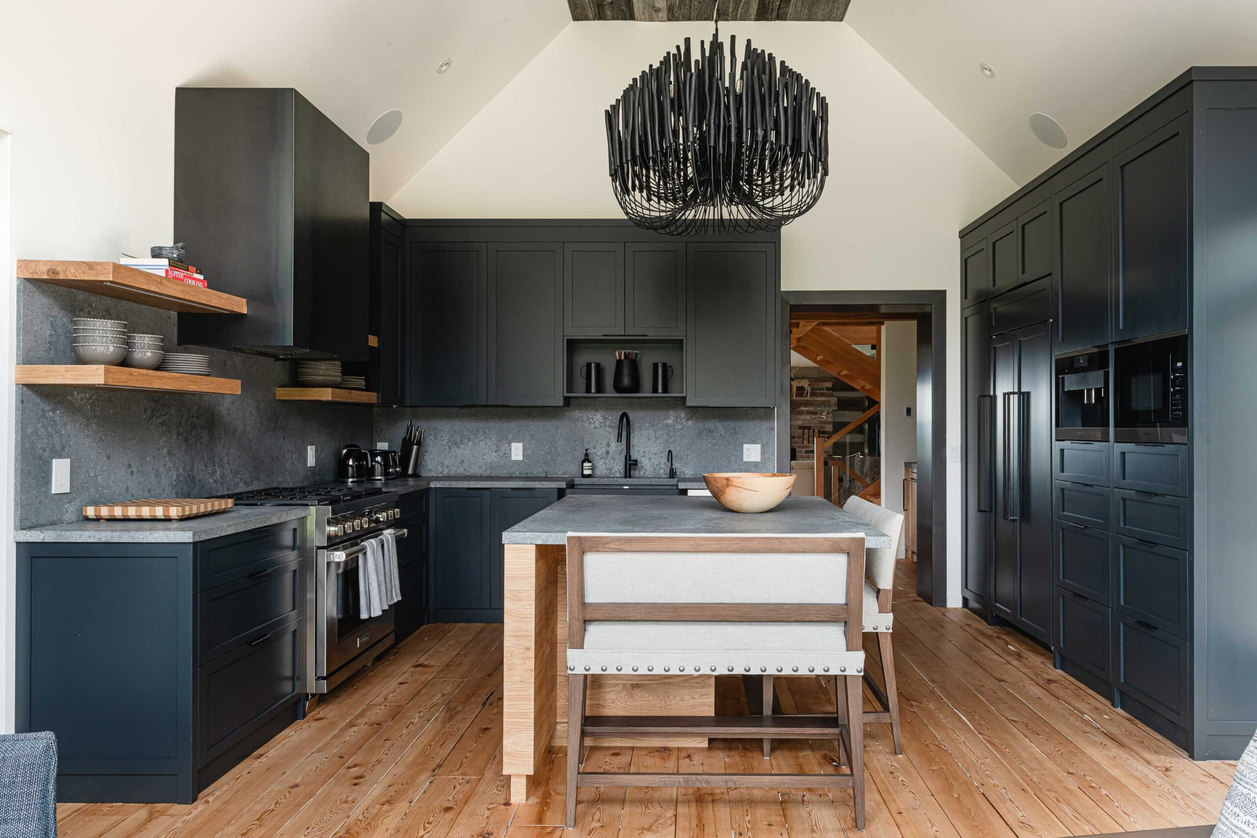 Dark moody kitchen in a modernized rustic chalet renovation by Blake Farrow Project, designed by FAD