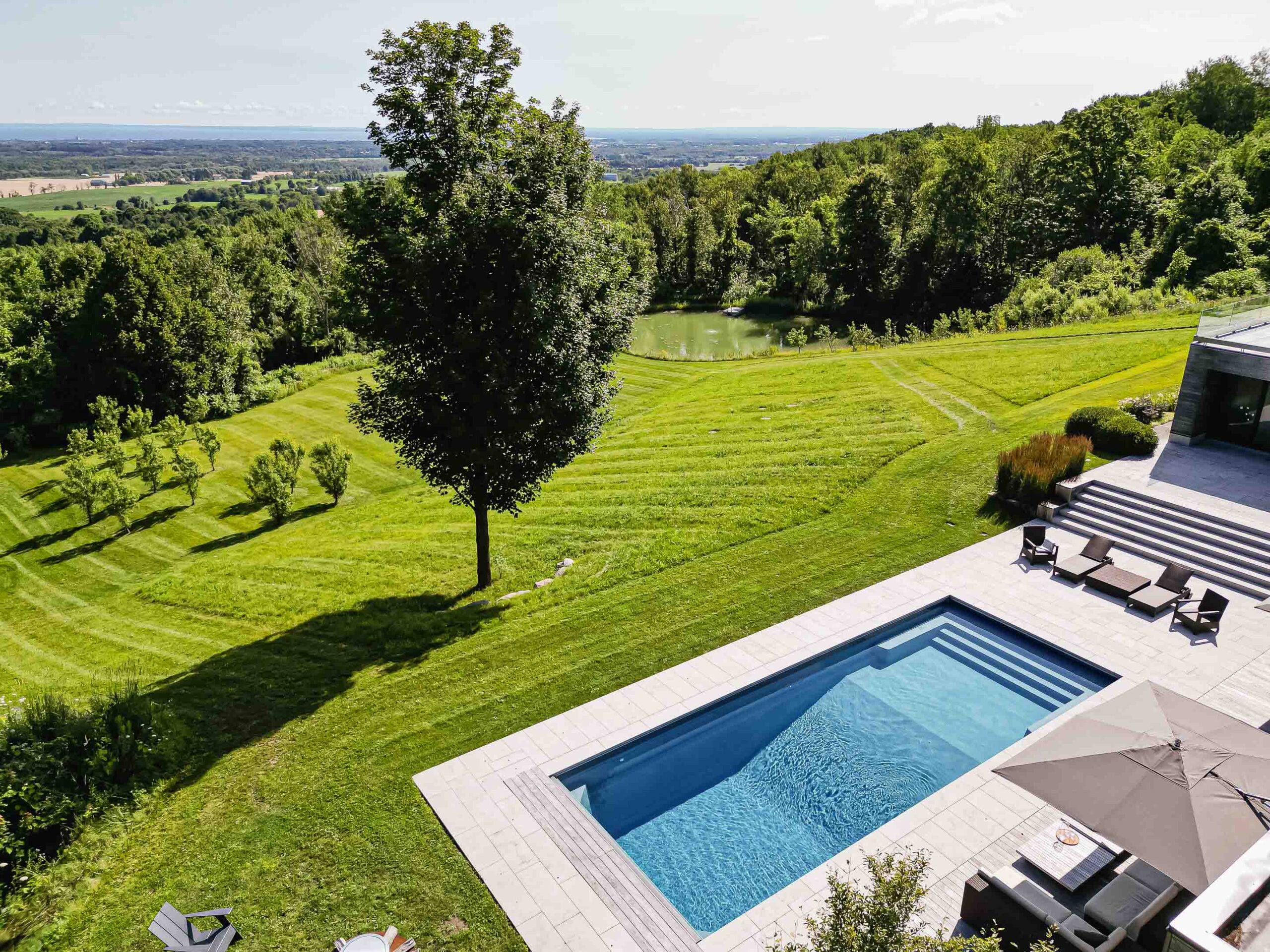 aerial view of a modern pool build by Blake Farrow Project, landscape design by Joel Loblaw