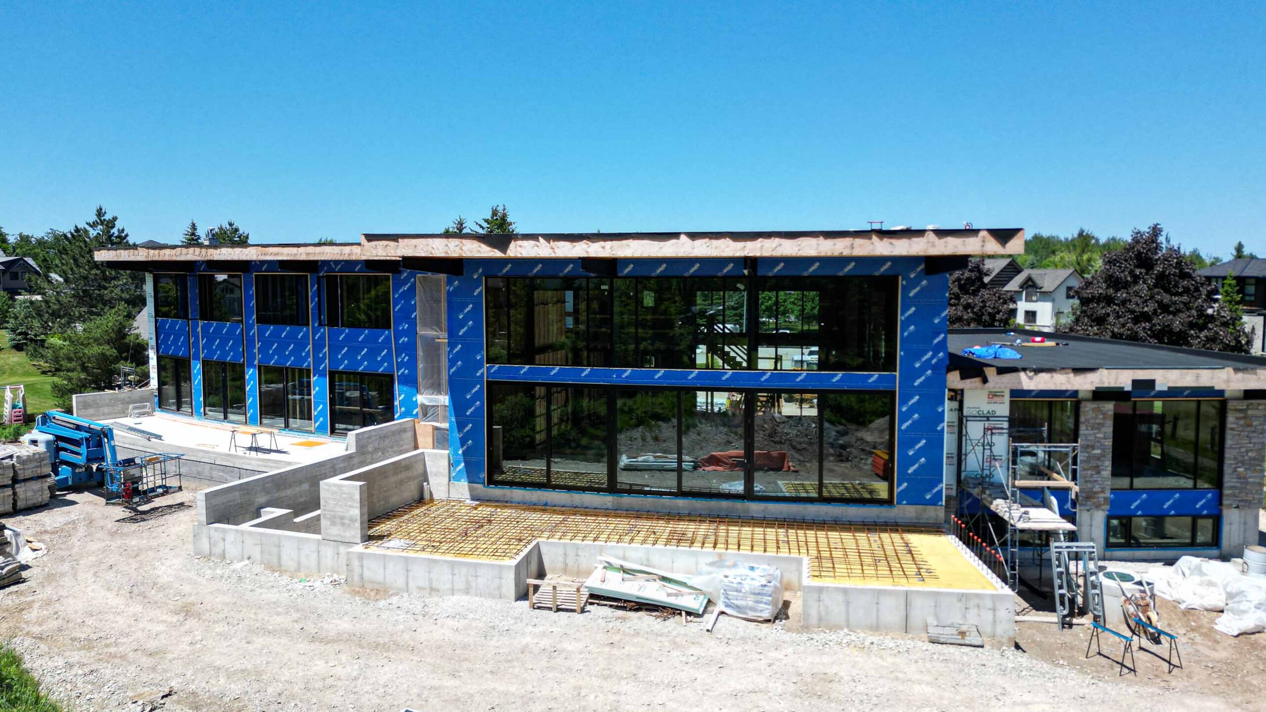 In construction, the escarpment facing side of a contemporary chalet being built by Blake Farrow Project Management