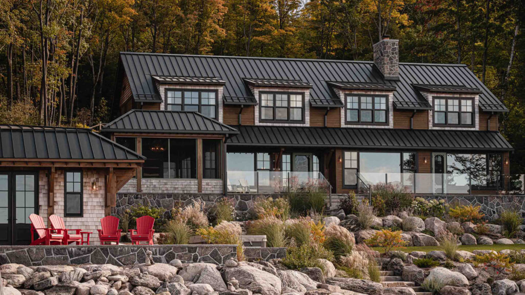 exterior of a waterfront contemporary cottage captured at dusk in the autumn