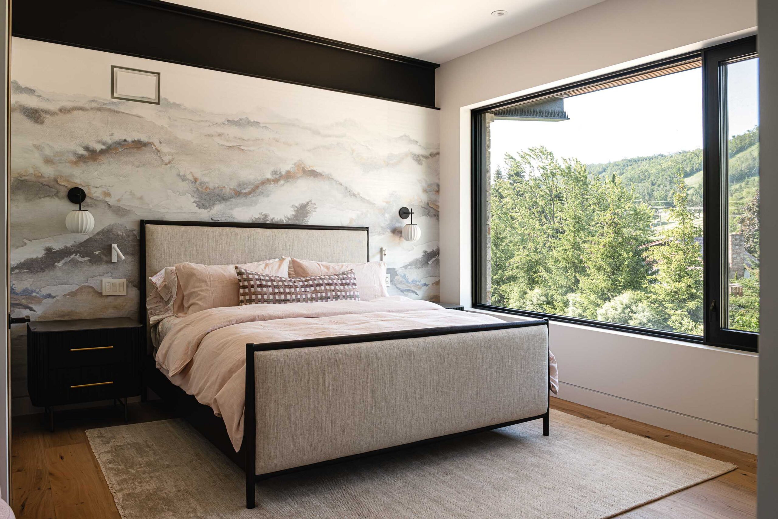 Modern Blue mountain chalet guest room overlooking the ski hill, with industrial metal detailing, custom fabric wallpaper, and modern furnishings