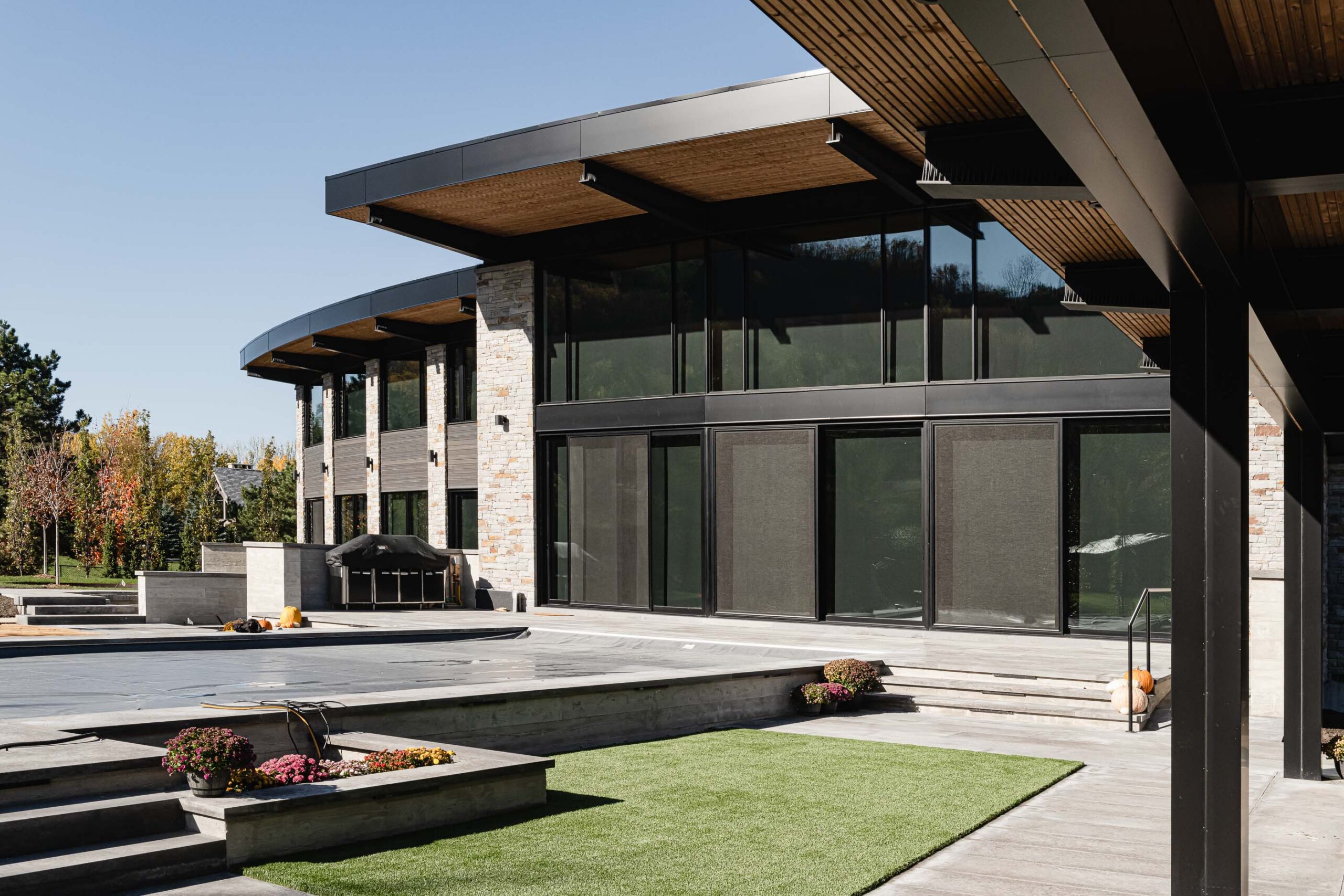 exterior detail of a modern chalet with extensive outdoor living areas