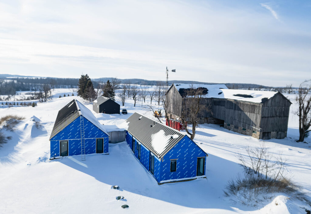 modern barn farmhouse being built by a Collingwood custom home builder