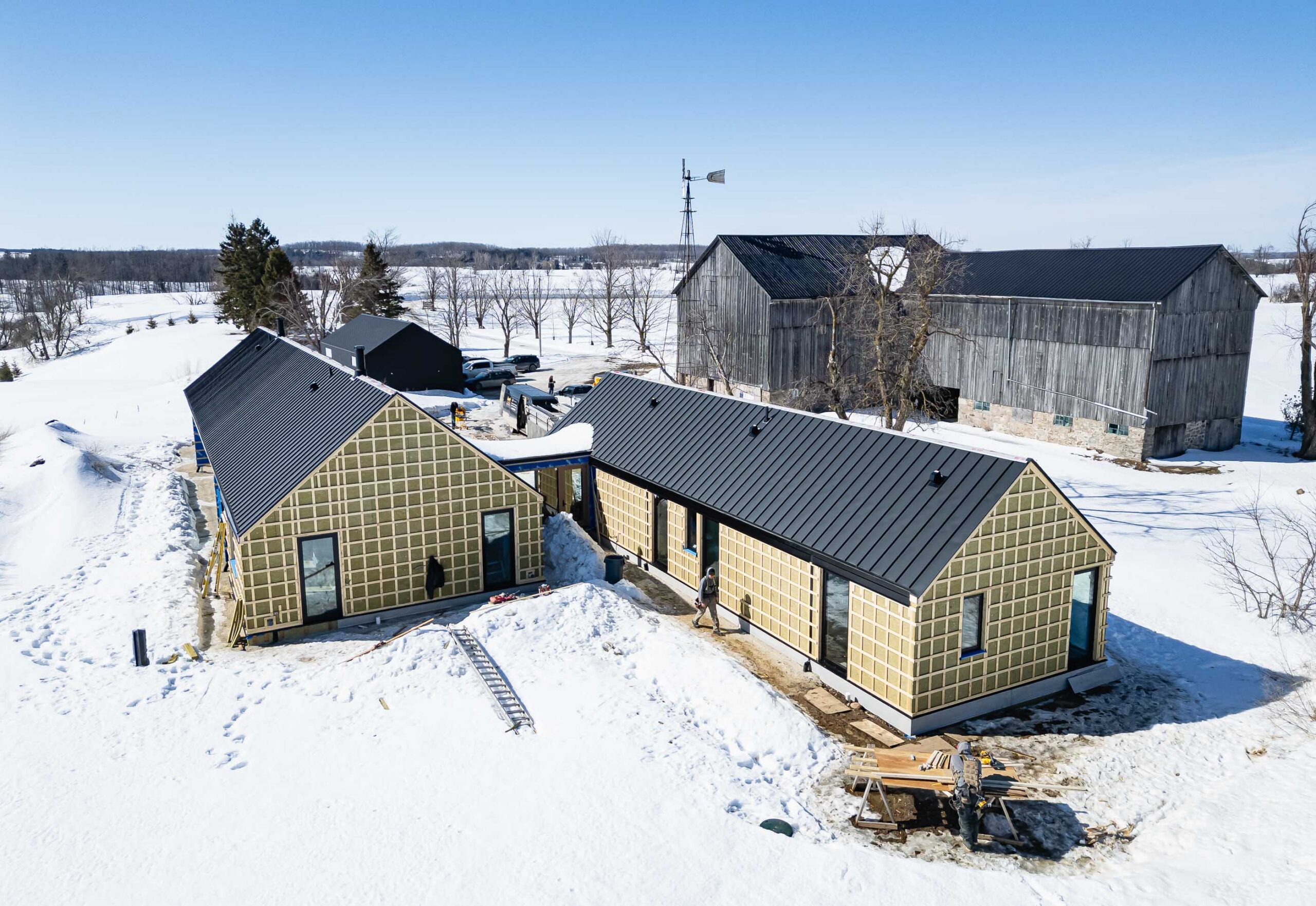 Contemporary Barn farmhouse being built by a Collingwood custom home builder, using advanced envelope techniques for durability, performance and comfort