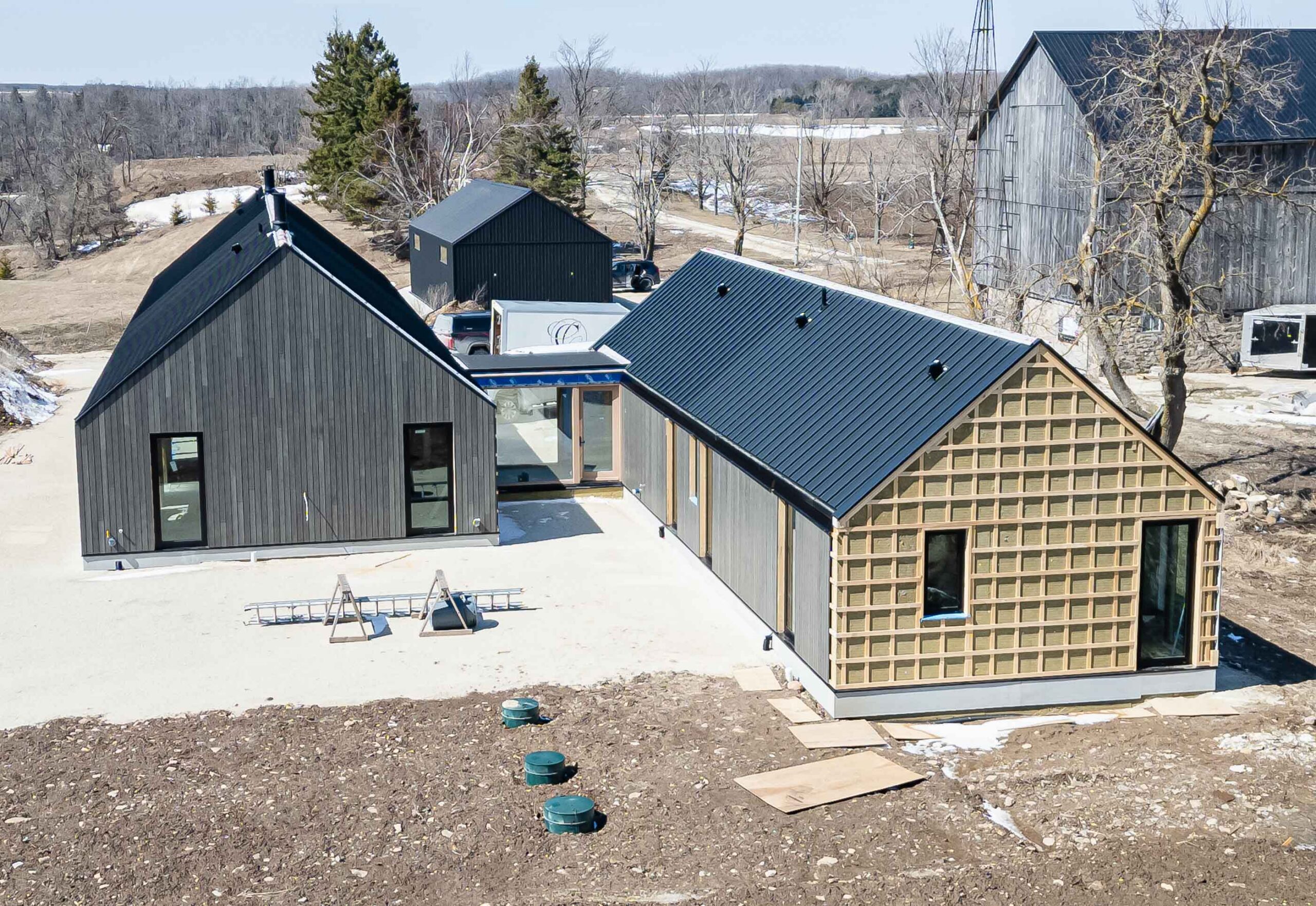 A modern barn farmhouse being built by an Ontario custom home builder, using advanced envelope techniques for comfort, durability and performance