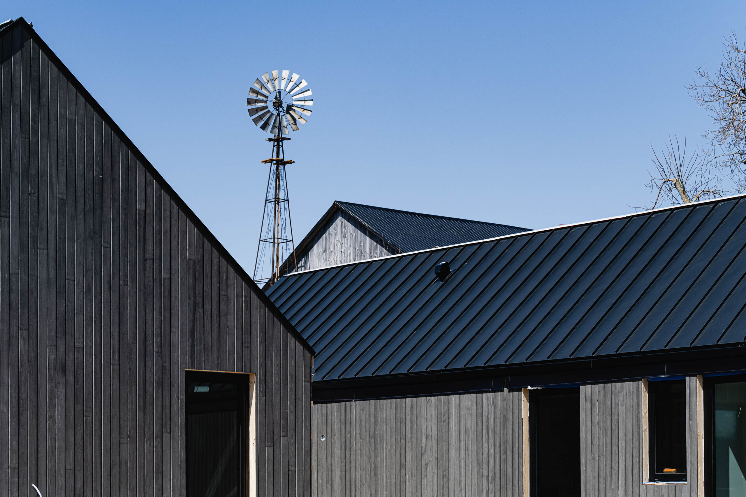 architectural details of a modern barn farmhouse in construction