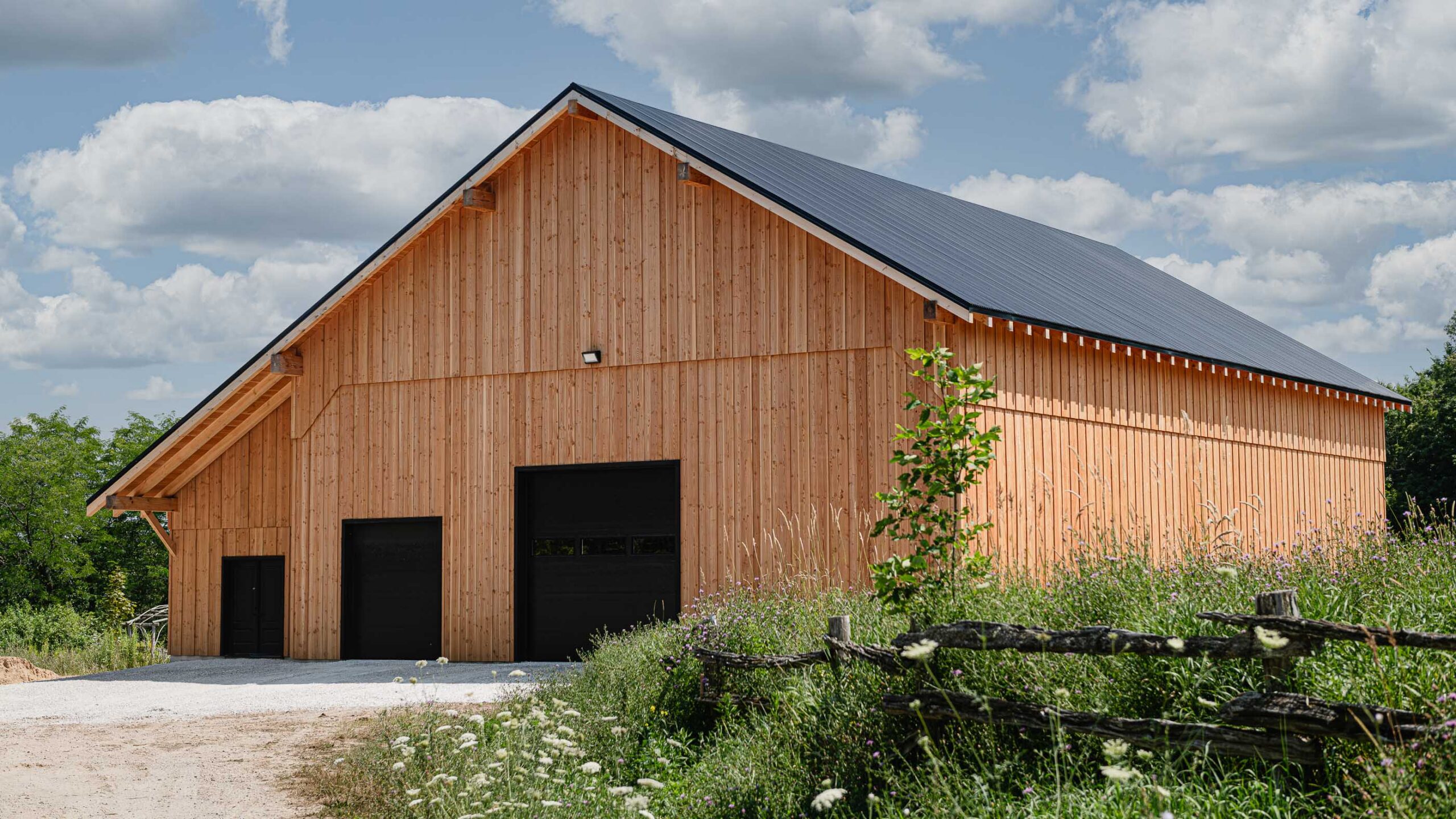 front elevation of a modern timber frame barn built by a collingwood custom home builder