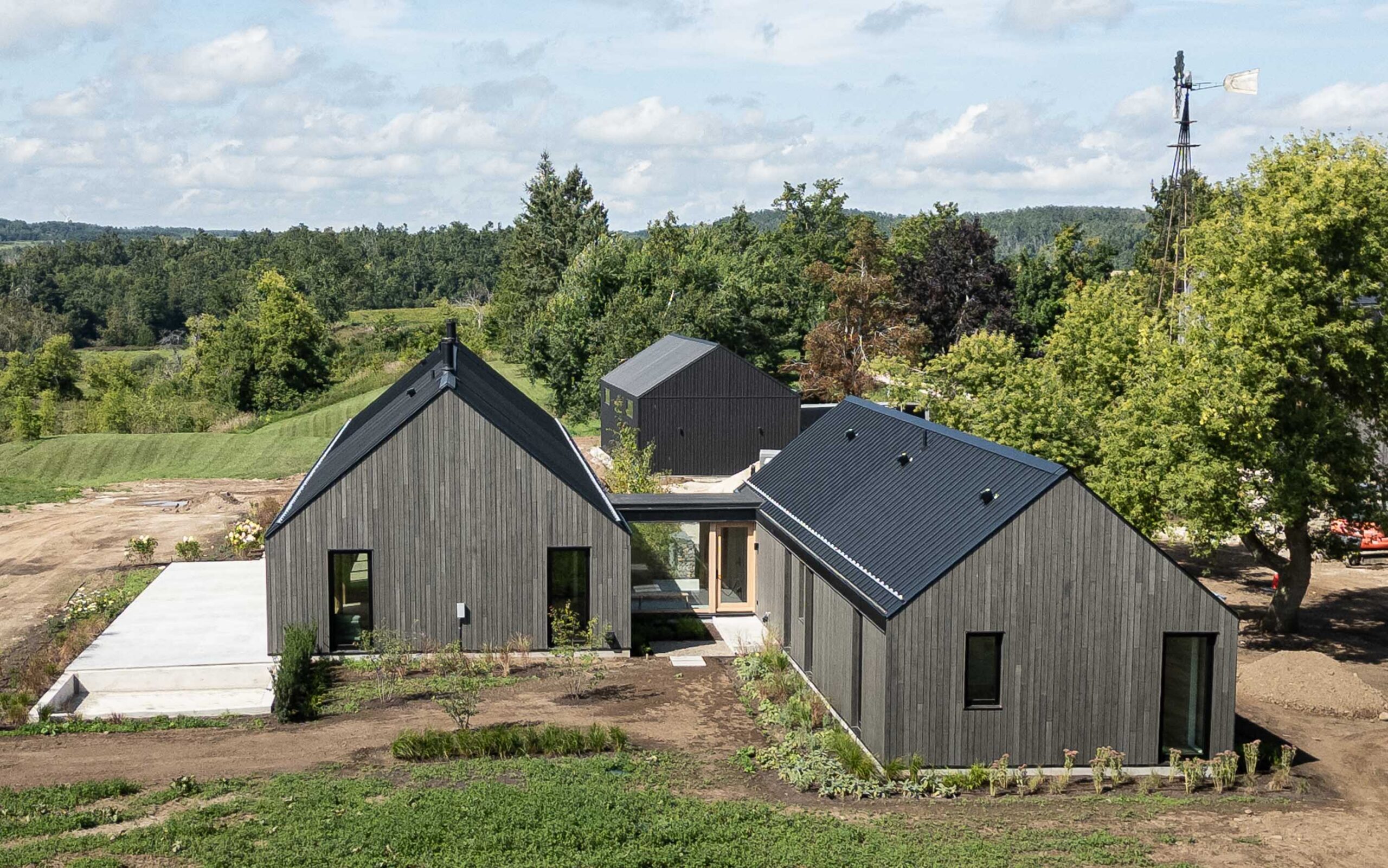 modern barn farmhouse being built by a Collingwood custom home builder