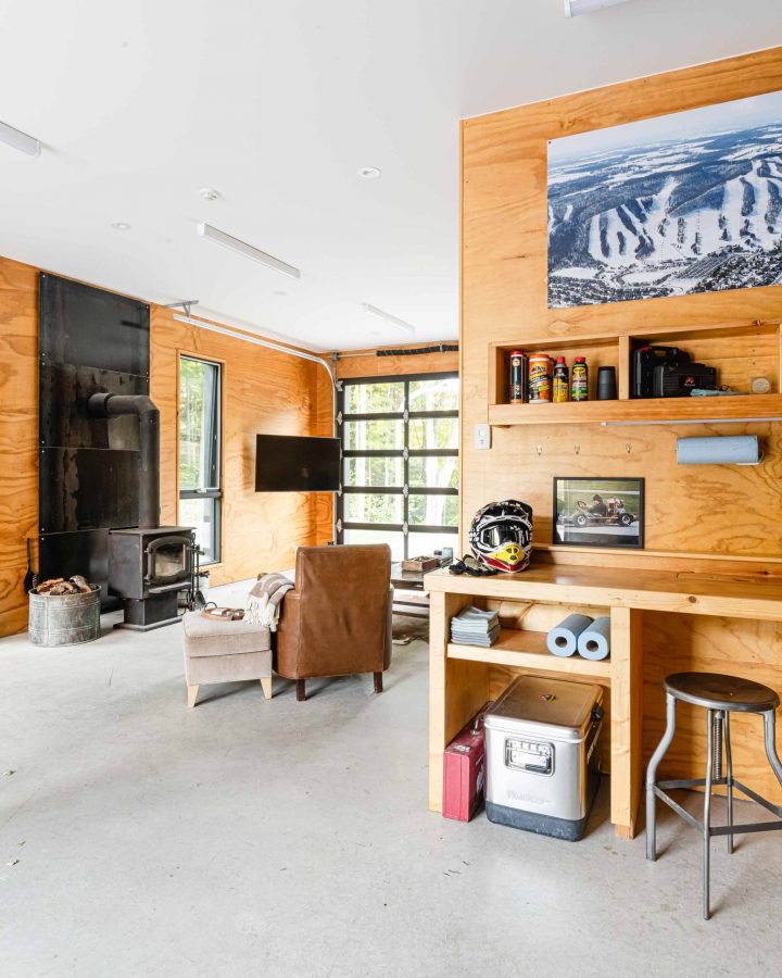 interior of a modern, minimalist garage and shop with plywood interior