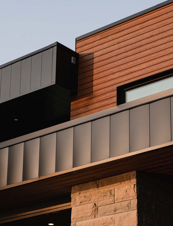 10-248-Bayside exterior detail of mixed materials used in the construction of a modern, contemporary custom home built by Blake Farrow Project
