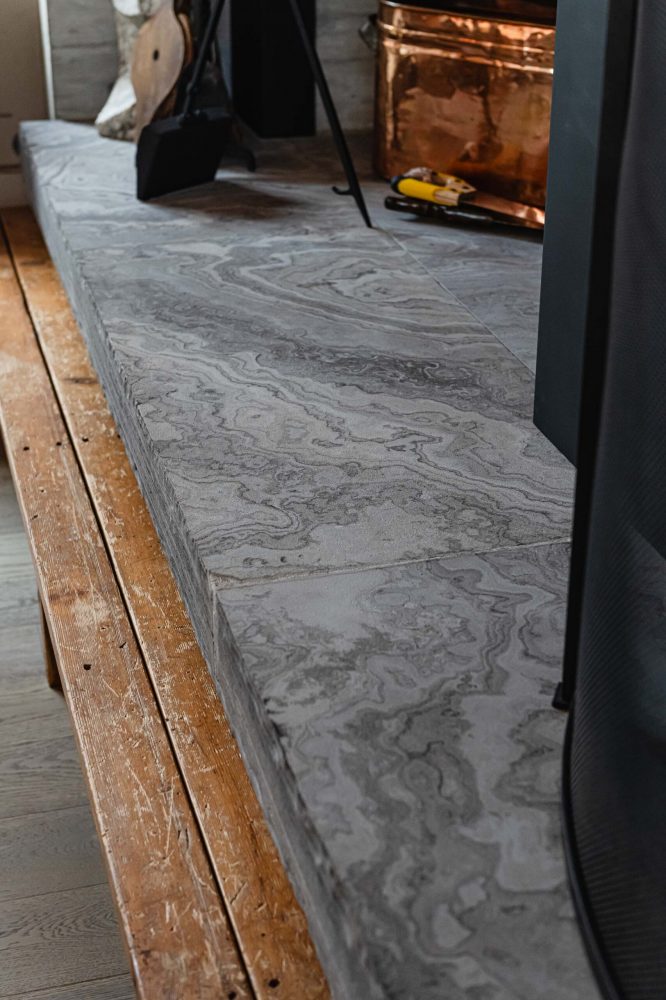 Fireplace hearth tile detail in a contemporary Blue Mountain ski chalet