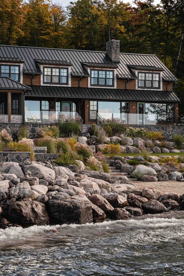 exterior of a waterfront cottage captured at dusk