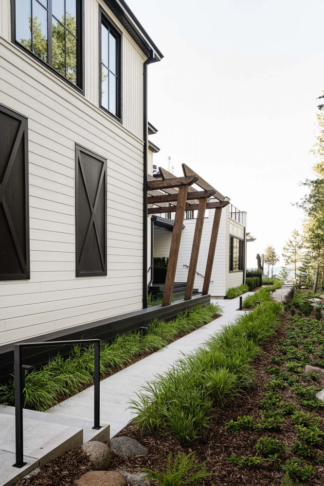 extensively landscaped side entry on a modern blue mountain beach house