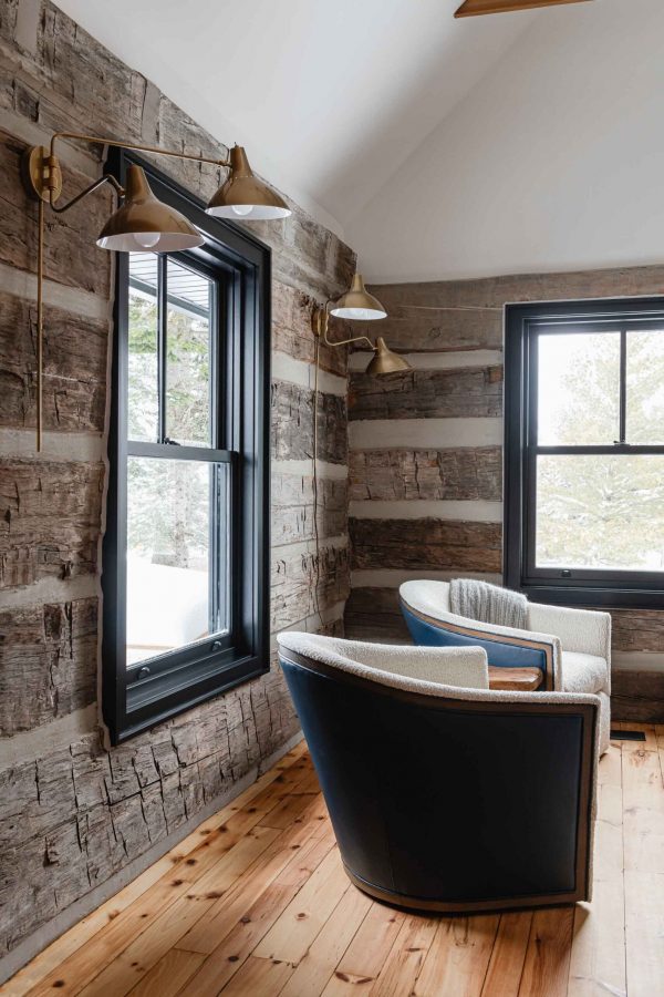 detail of the original hand-hewn log cabin walls preserved during a renovation project by Blake Farrow Project