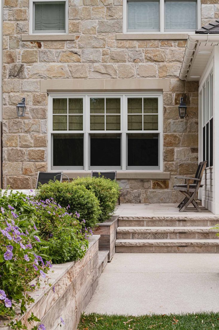 Patio detail on a English cottage-style stone house built by a Collingwood custom home builder