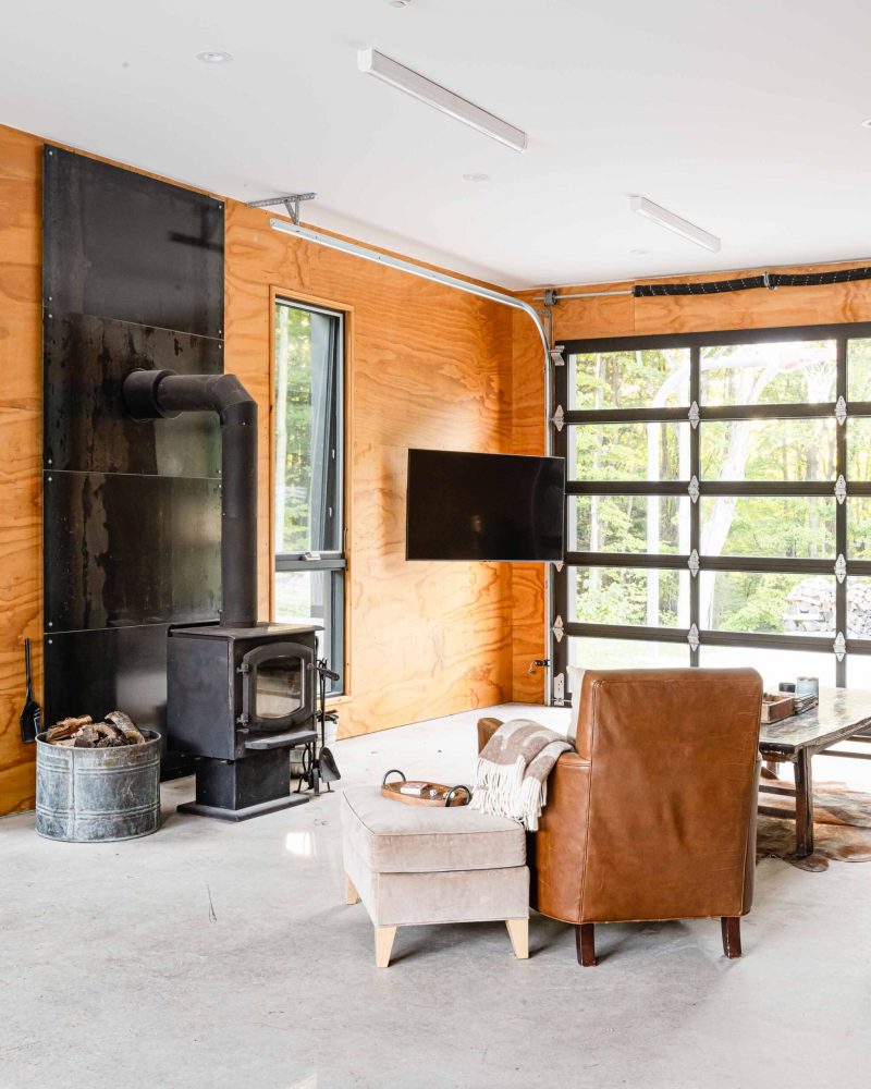 interior of a modern, minimalist garage and shop with plywood interior