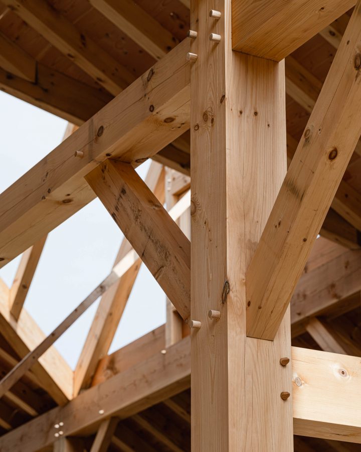 detail in a timber frame barn showing the joinery techniques used in the construction
