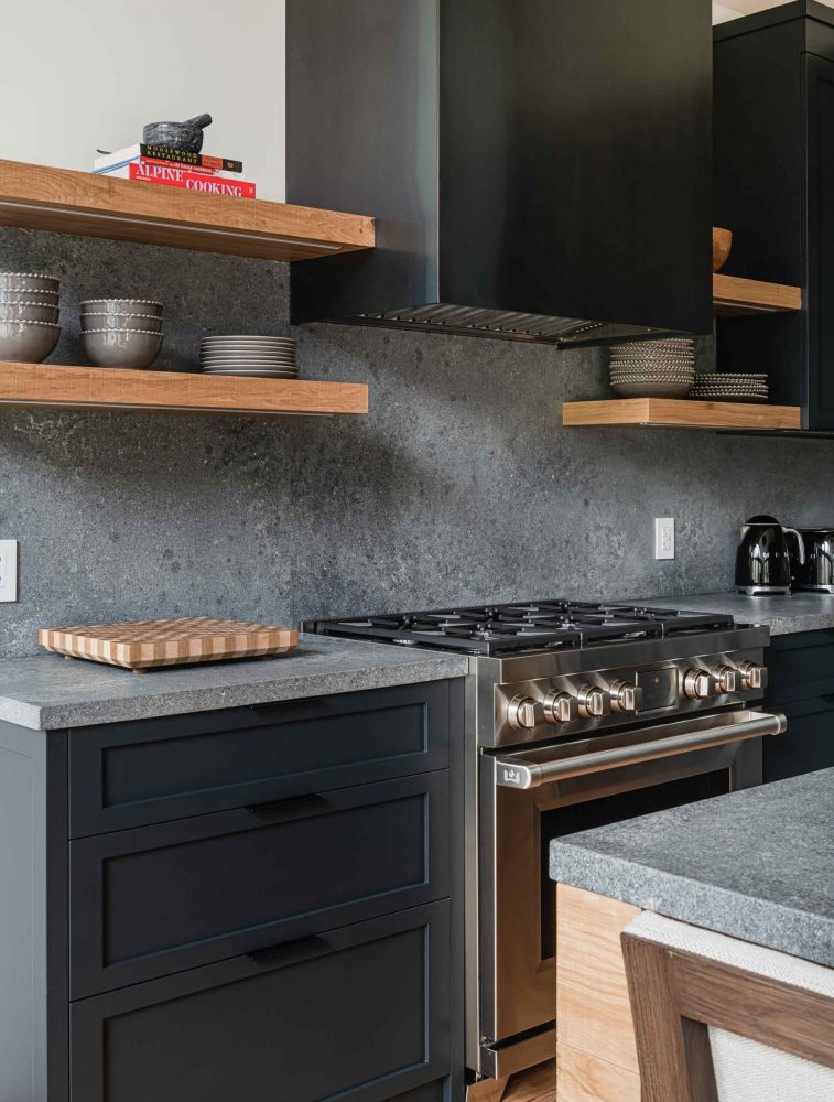 Dark moody kitchen in a modernized rustic chalet renovation by Blake Farrow Project, designed by FAD