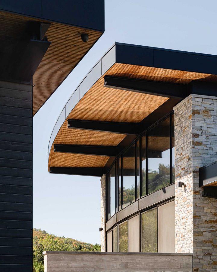 Exterior detail of a luxury Blue Mountain chalet with distinctive curved architecture