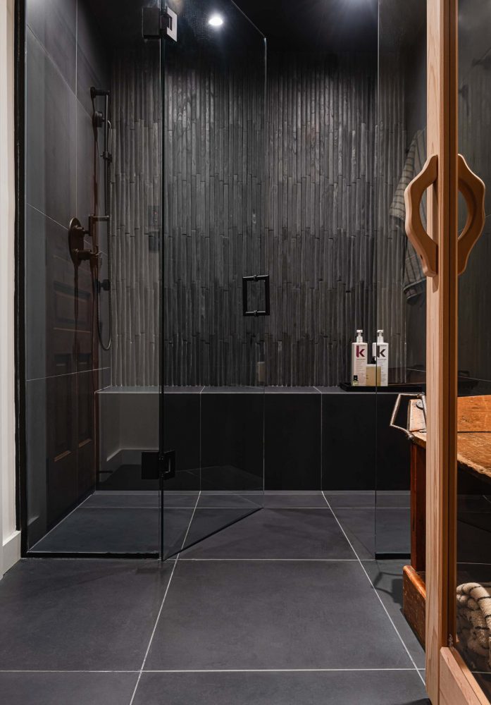 26-262-Chalet detail of the black tiled sauna in a custom built home by Blake Farrow Project