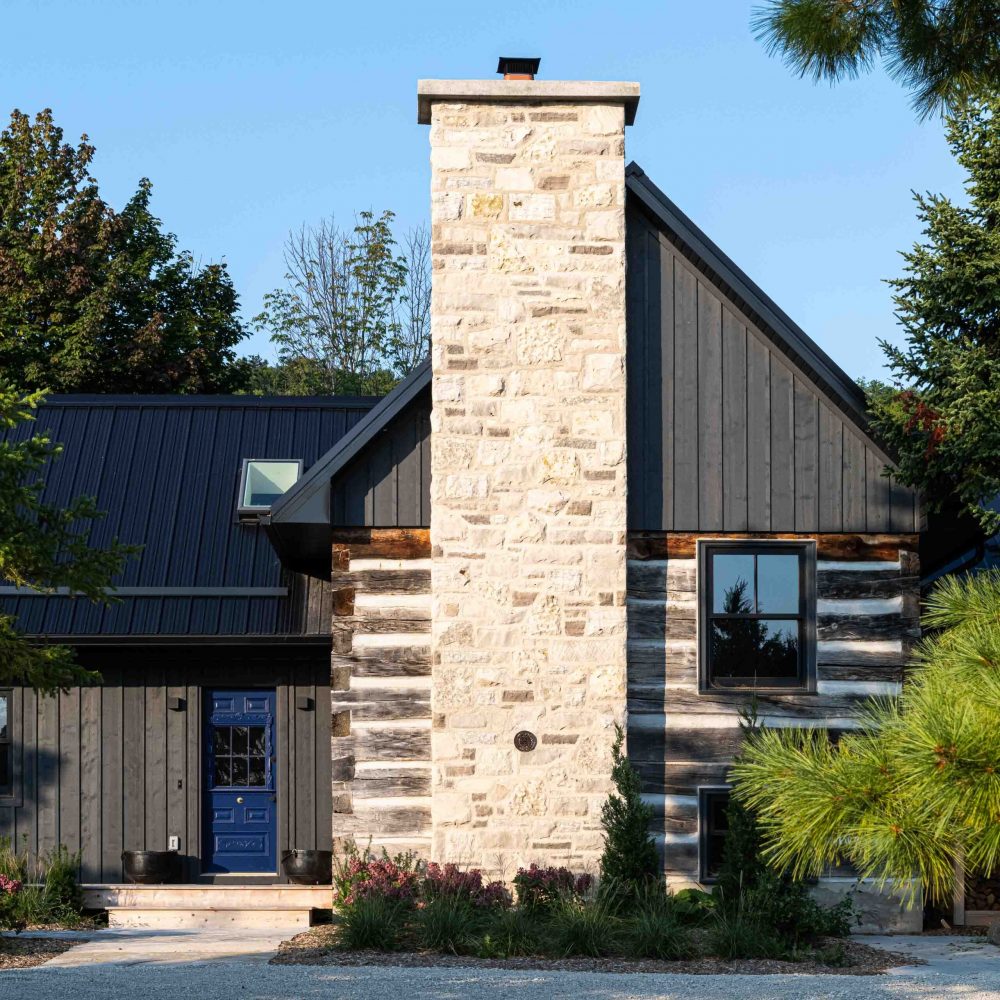 exterior of a rustic log cabin renovation with a contemporary addition, built by Blake Farrow Project