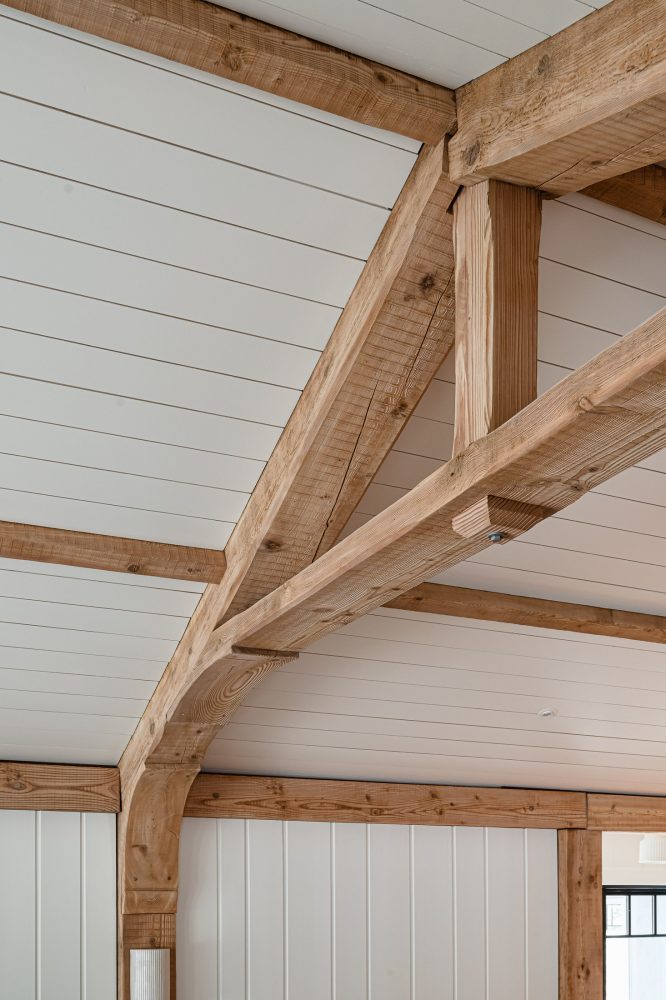 Close-up of sandblasted timber beam showing restored natural grain