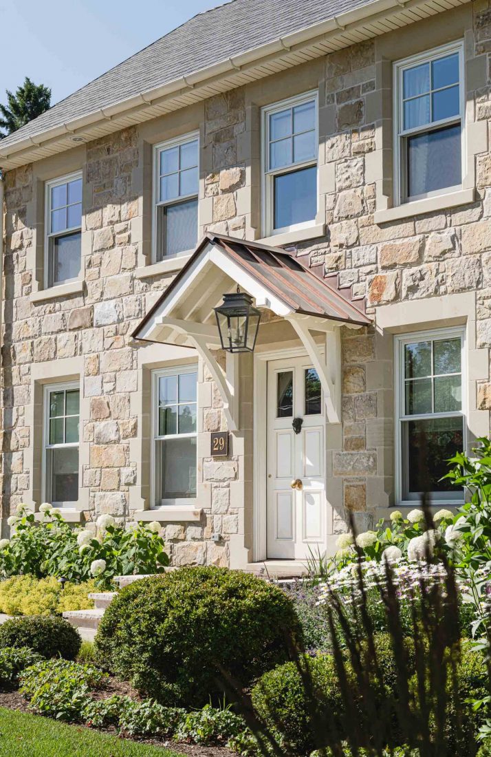 English cottage-style stone house built by a Blue Mountain custom home builder