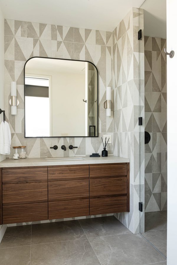 Contemporary Blue Mountain chalet bathroom with geometric tile walls, floating vanity and heated tile floor
