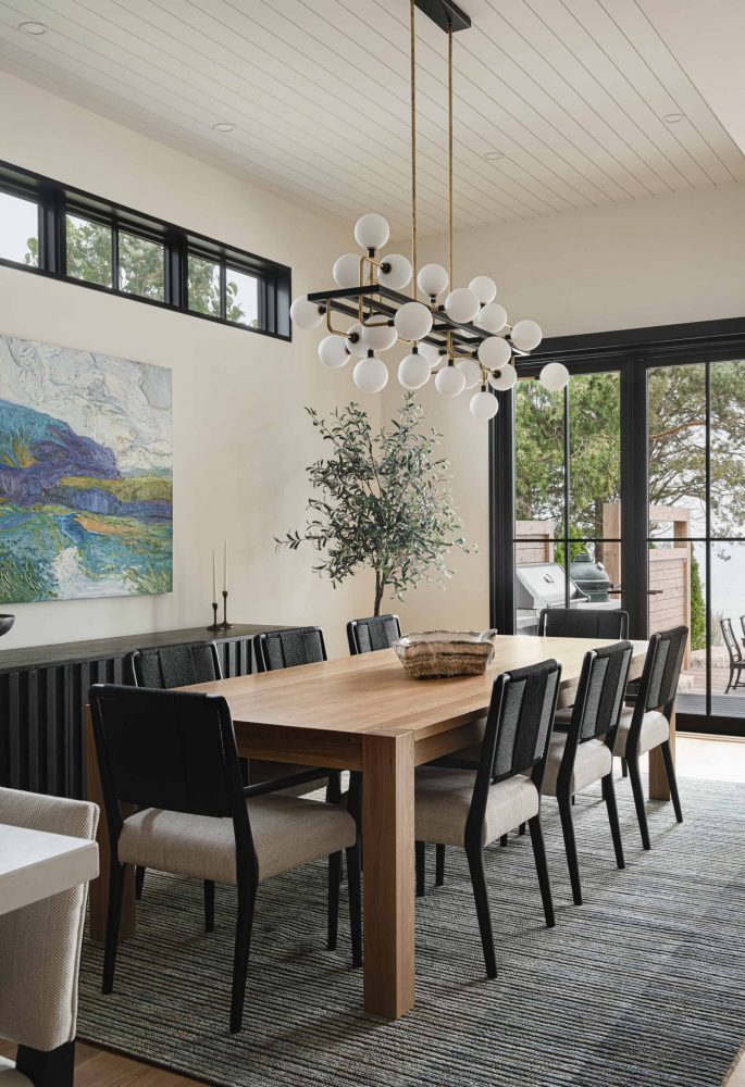 Contemporary dining room in a waterfront luxury beach house built by a Collingwood custom home builder