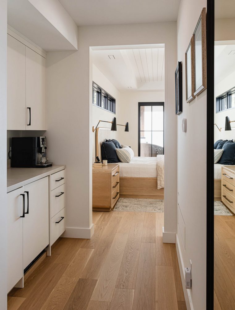 Primary suite in a waterfront beach house with custom coffee station