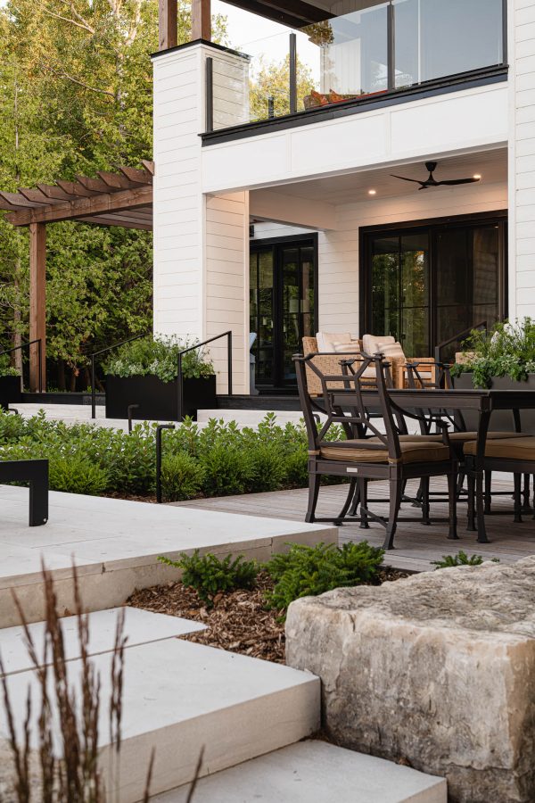 Luxury modern beach house exterior with individual outdoor living areas by Blue Mountain custom home builder