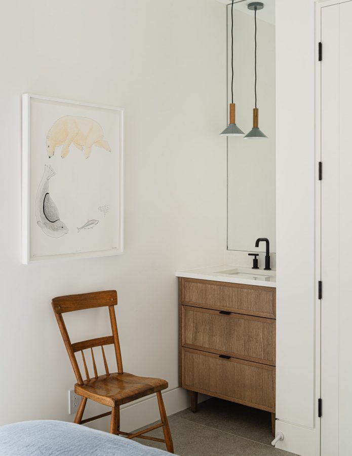 Contemporary bedroom featuring a refined vanity nook, reimagining a traditional chalet design element